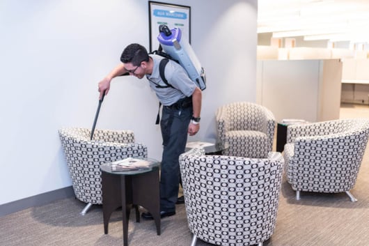 Sentral Services Employee Vacuuming 